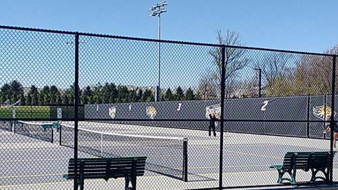 A photo of Towson's women's tennis team warming up before a Sunday morning match in 2016.